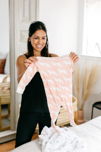 Woman observing her child's clothing for fragrance and synthetic-chemicals