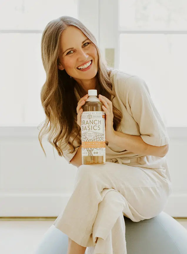 Kelly posed with a bottle of Branch Basics Concentrate
